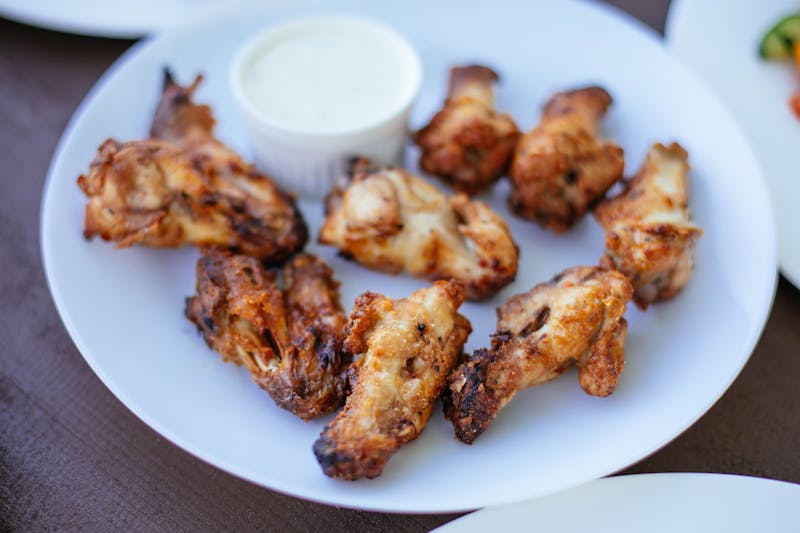 Buffalo wings with blue cheese dipping sauce