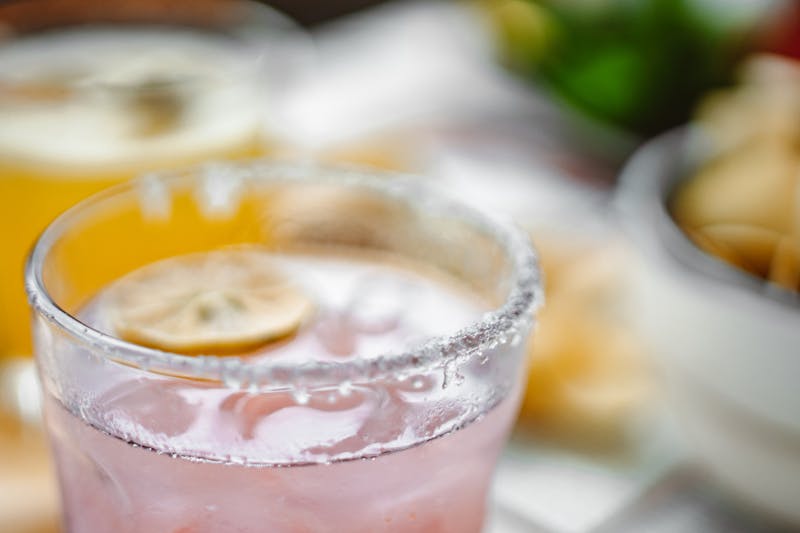 Fresh lemonade in a tall glass with ice